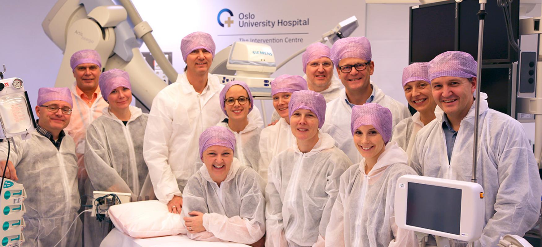 Photo of the team of the Nordic Network of Test Beds posing in a operation theater.