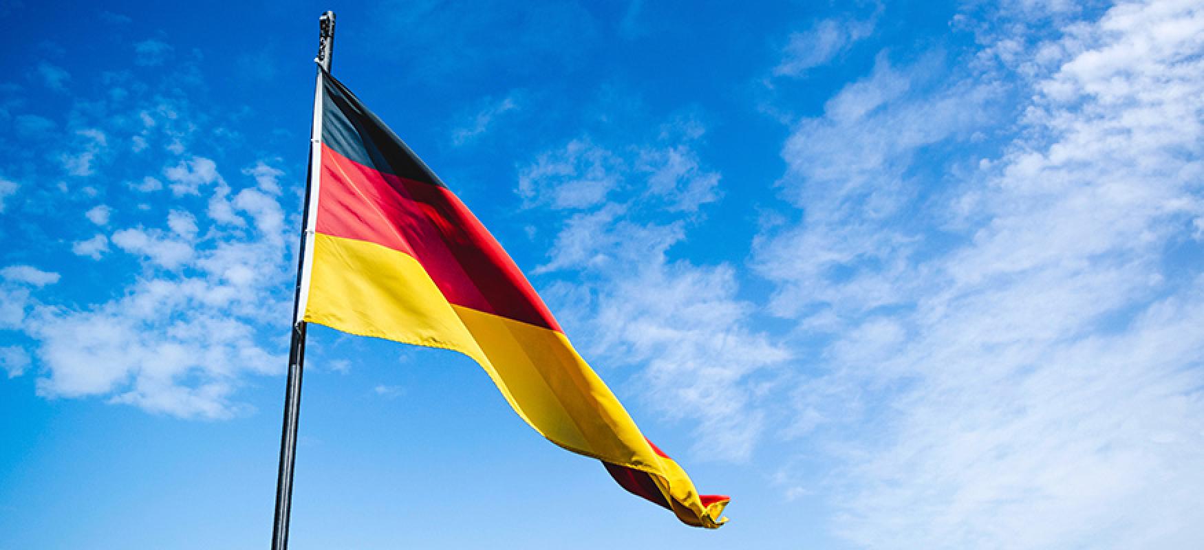 German flag against blue sky