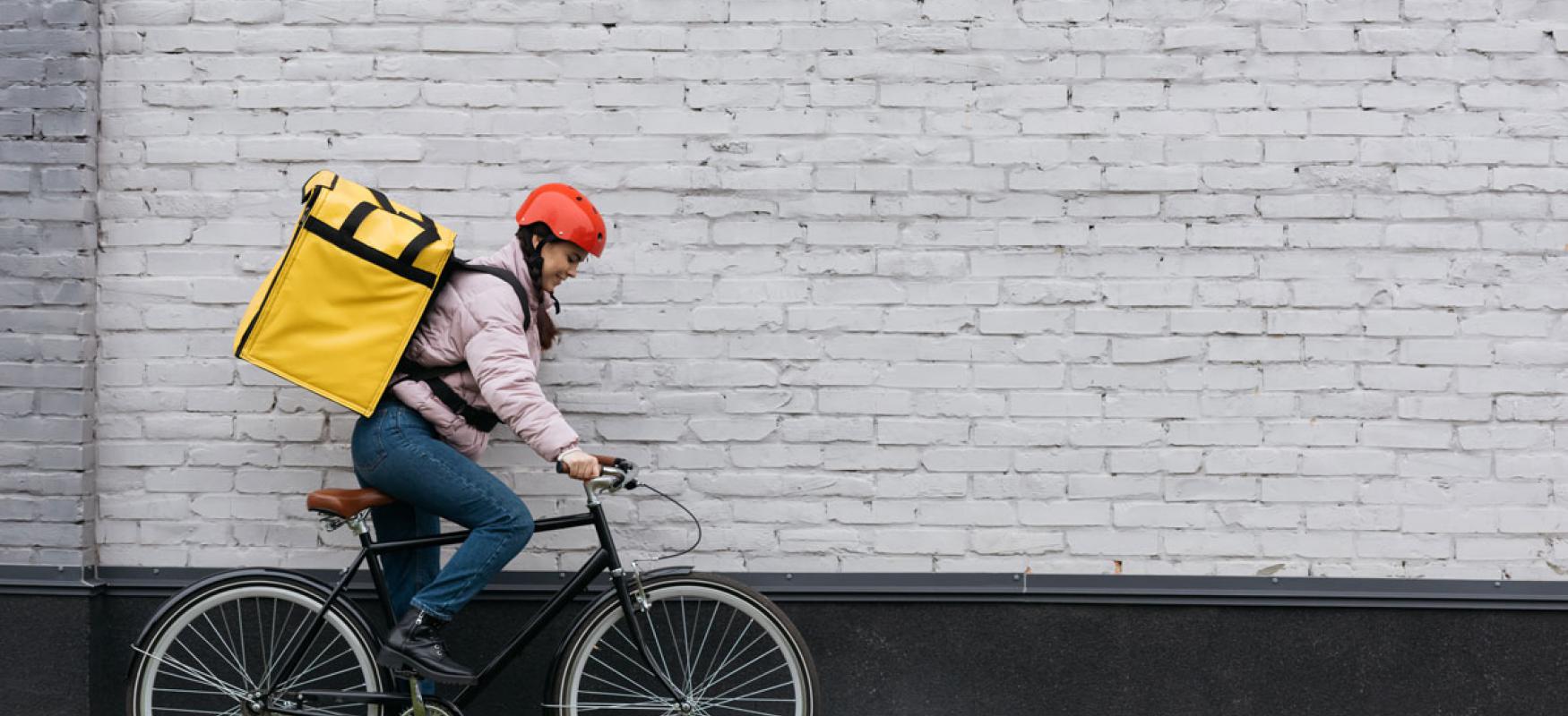 Woman courier on bike