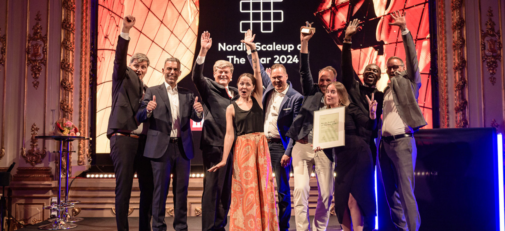 Qred winner of Nordic Scaleup Award 2024 on stage with Svein Berg, Nordic Innovation