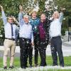 The project team throwing feathers into the air.