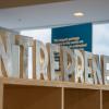 Letters on top of a bookcase spelling out "entrepreneurs", New York 2019.