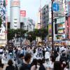 Pedestrians in a busy crossroads in Tokyo.