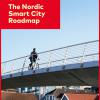 Publication frontpage showing a cyclist crossing a bridge with wooden houses in the background.