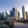 A waterside boardwalk with the Singapore skyline in the background.