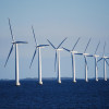 A row of 10 wind turbines standing in the sea