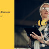 Image of the front page of the report showing a woman in work clothes holding an iPad