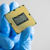 hand holding up a semi conductor chip