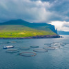 Fish farm on outskirts of Sandavagur village, Faroe Islands